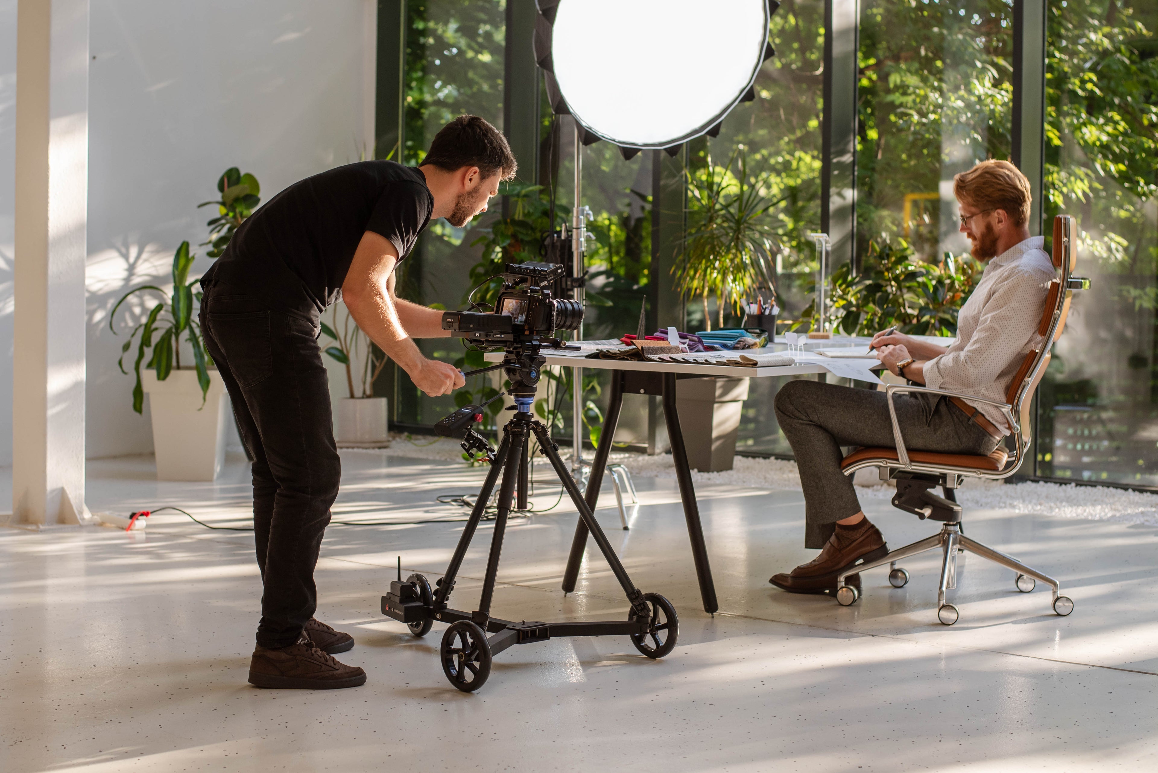 Behind-the-scenes of a commercial set featuring the Blackmagic 6K (BMPCC 6K) mounted on the Hyperdolly HY-01 for cinematic tracking.