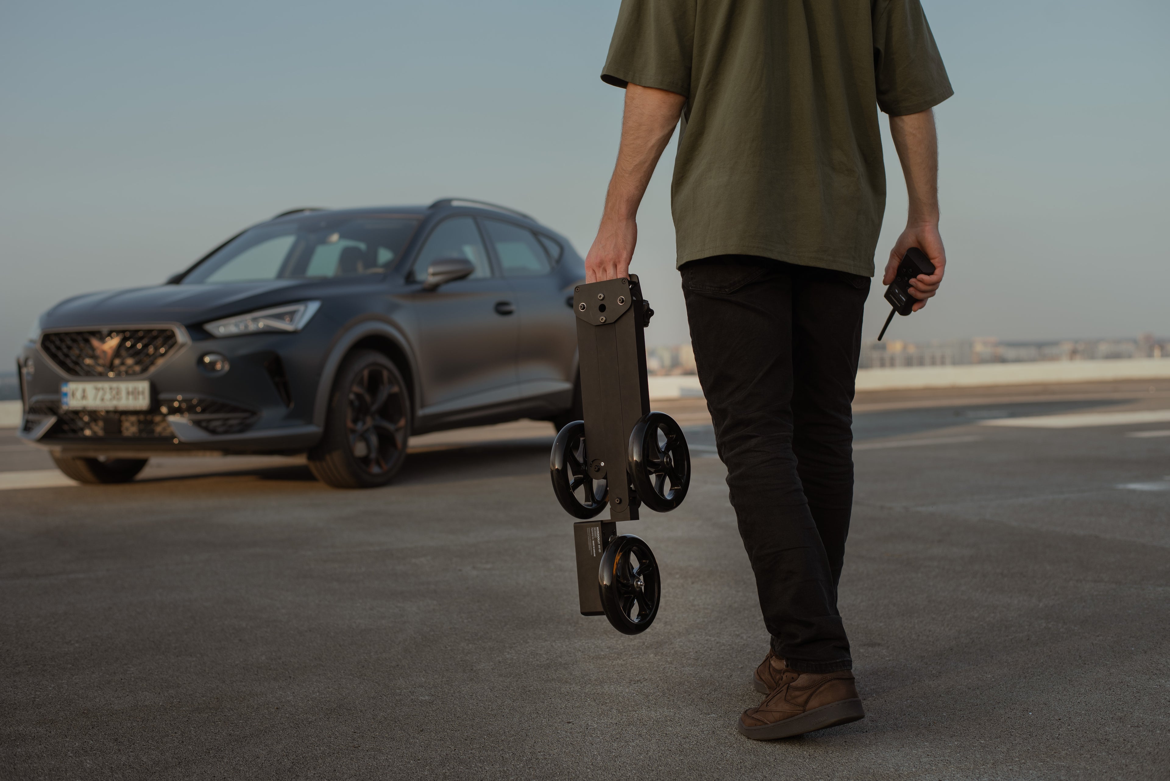 Hyperdolly HY-01 in its compact folded state with an integrated carrying handle for effortless one-handed transportation.